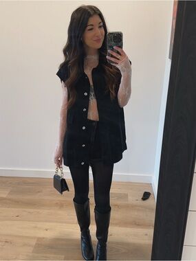 Oversized women’s black denim vest